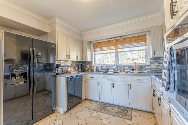 kitchen with tasteful backsplash, sink, white cabinets, and black appliances