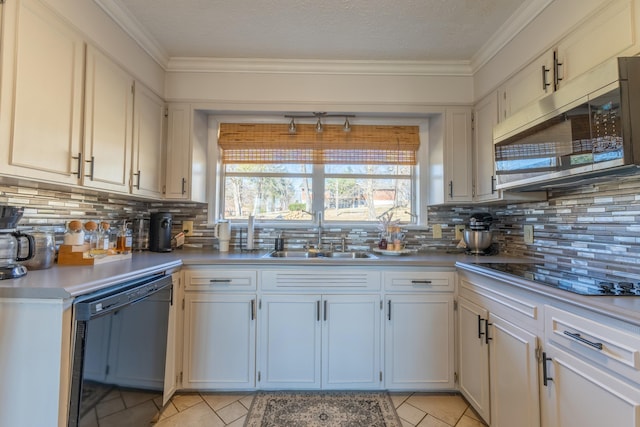 kitchen featuring white cabinetry, sink, black appliances, and light tile patterned flooring