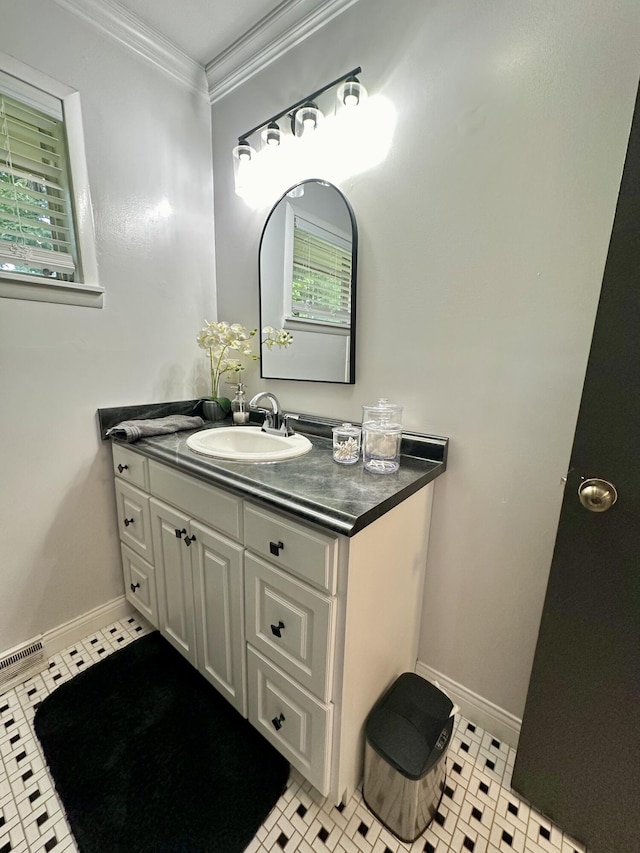 bathroom featuring ornamental molding, tile patterned flooring, and vanity