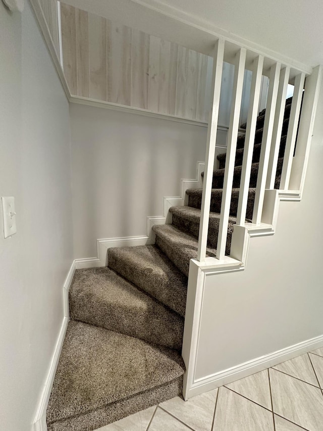 stairway featuring tile patterned floors