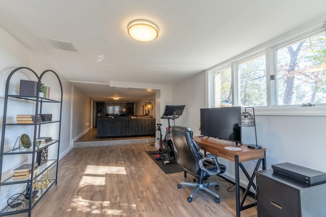 home office featuring hardwood / wood-style flooring