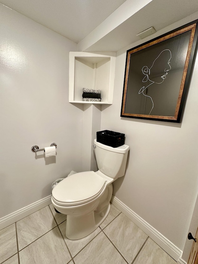 bathroom featuring tile patterned floors and toilet