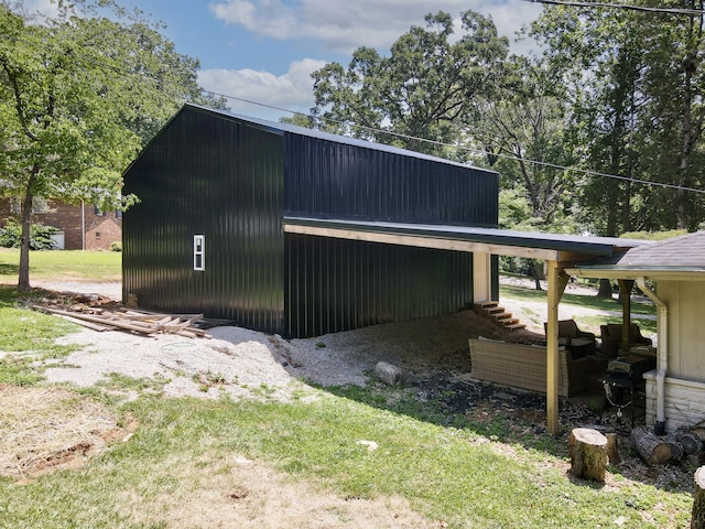 view of side of property with a yard