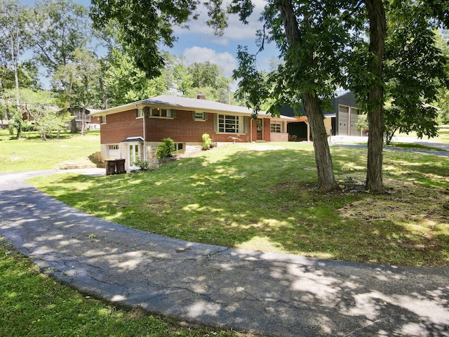 view of front of property with a front lawn