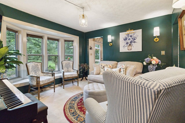 living room featuring carpet floors and a textured ceiling