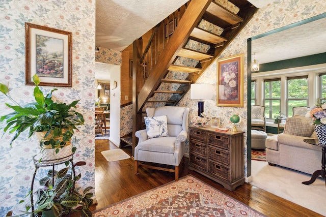 sitting room featuring hardwood / wood-style floors and a textured ceiling