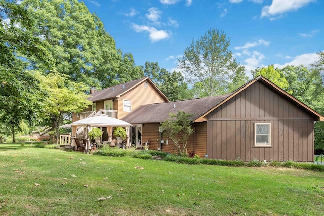 view of front of home featuring a gazebo and a front yard