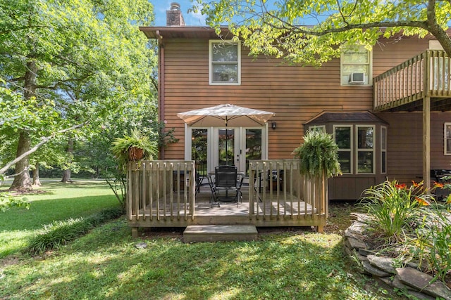 back of house with cooling unit, a wooden deck, a yard, and french doors