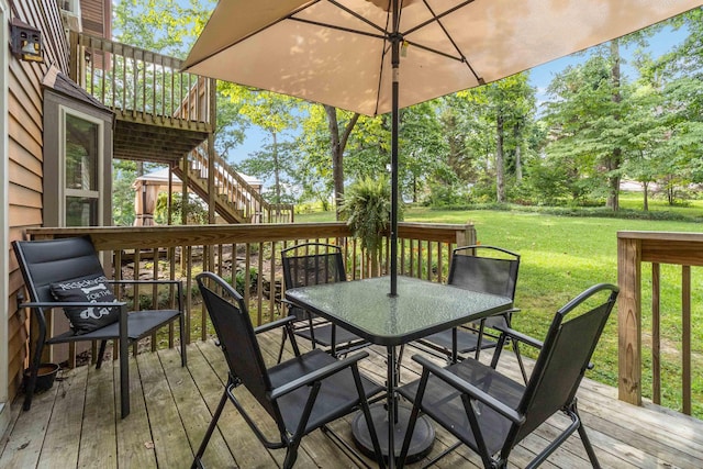 wooden deck with a yard