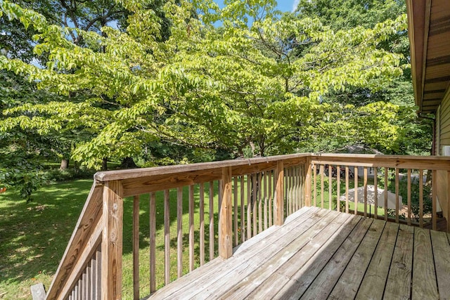 wooden terrace with a lawn