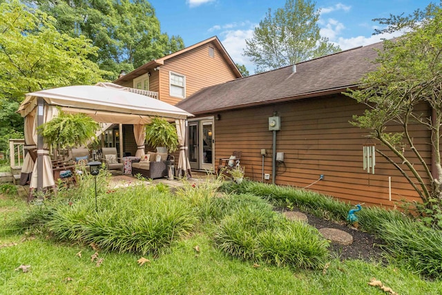 back of property featuring outdoor lounge area