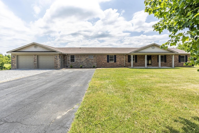 single story home with a garage and a front yard