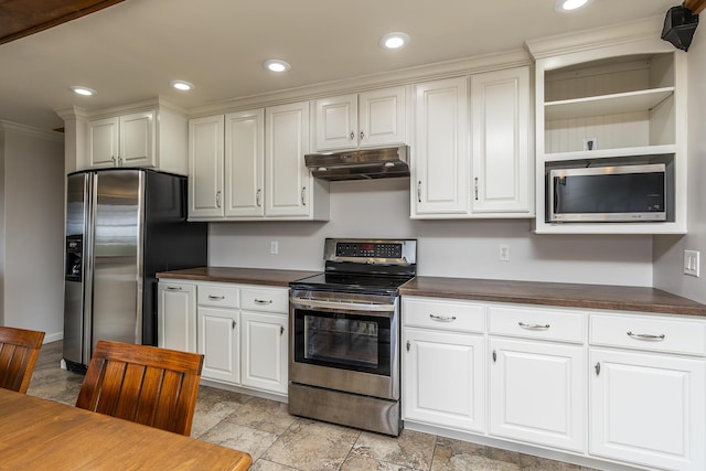 kitchen featuring wood counters and appliances with stainless steel finishes