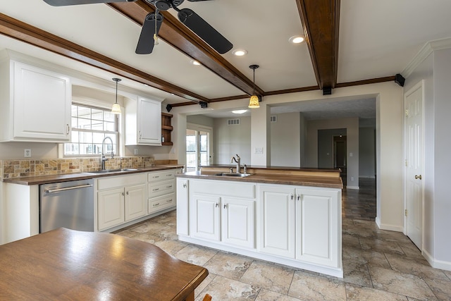 kitchen with a kitchen island, pendant lighting, white cabinetry, dishwasher, and sink