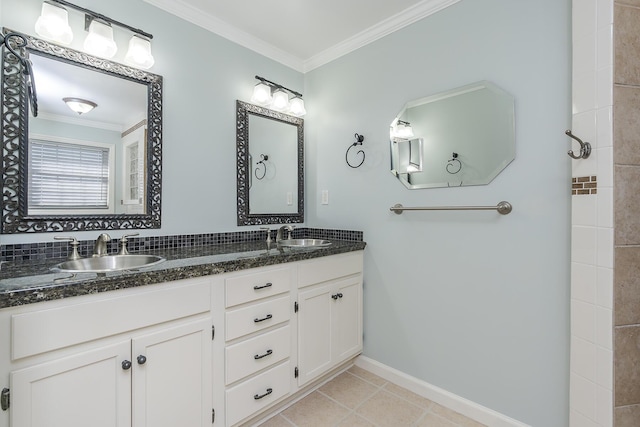 bathroom with crown molding, vanity, and tile patterned floors