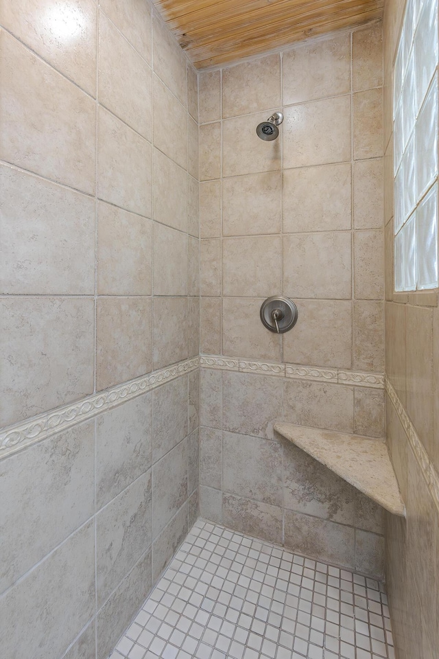 bathroom featuring tiled shower