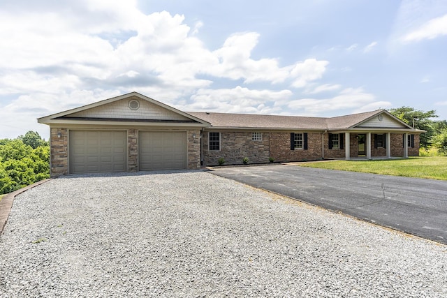 ranch-style house with a garage and a front lawn