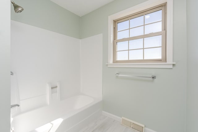 bathroom with shower / bathing tub combination