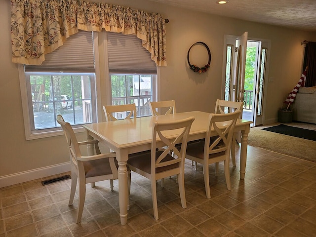 dining area featuring a healthy amount of sunlight