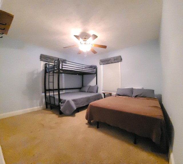 bedroom featuring ceiling fan and carpet floors