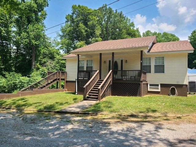 view of front of house featuring a front yard and a porch