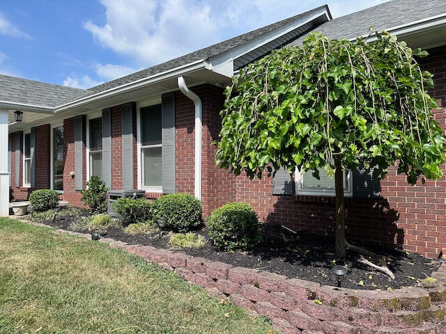 view of home's exterior featuring a lawn