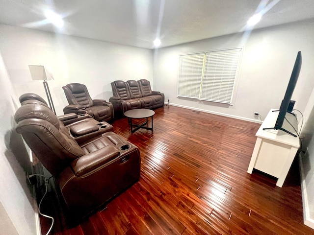 living room with dark hardwood / wood-style flooring