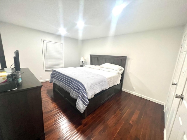 bedroom featuring dark wood-type flooring