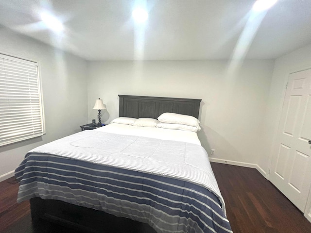 bedroom featuring dark hardwood / wood-style floors