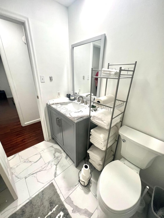 bathroom with vanity and toilet