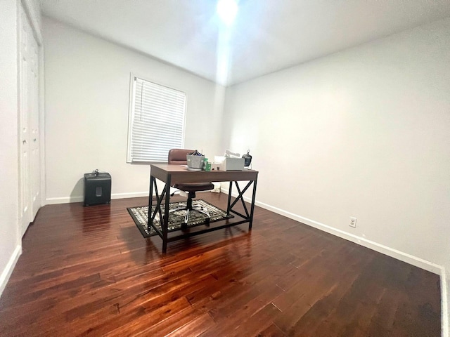 home office featuring dark wood-type flooring