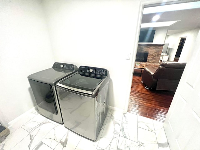 clothes washing area featuring washing machine and clothes dryer