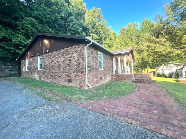 view of home's exterior featuring a yard