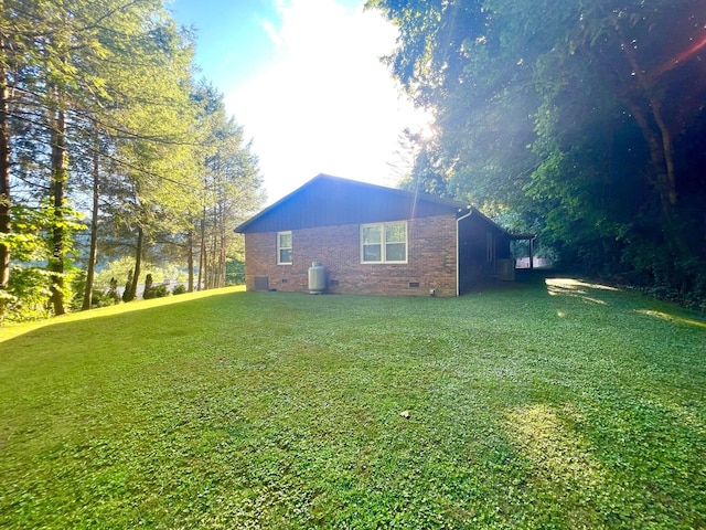 view of home's exterior with a lawn