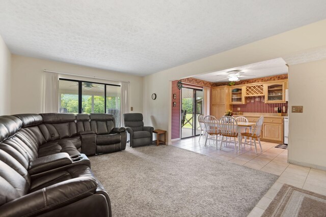 37-2 Woodson Bend Resort, Bronston, KY 42518 - living area featuring a ceiling fan, a textured ceiling, light tile patterned flooring, and a healthy amount of sunlight
