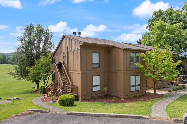 37-2 Woodson Bend Resort, Bronston, KY 42518 - view of side of home featuring stairway and a lawn