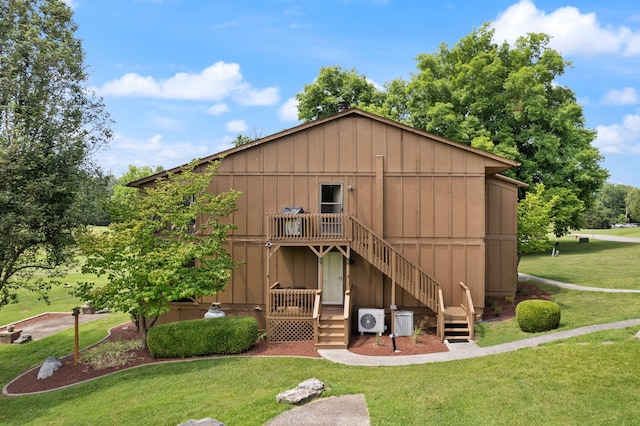 37-2 Woodson Bend Resort, Bronston, KY 42518 - back of house featuring a lawn, stairway, board and batten siding, and ac unit