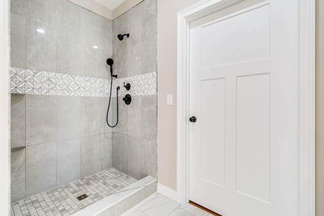 bathroom with a tile shower