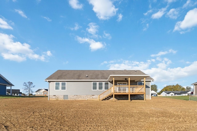 back of house featuring a lawn