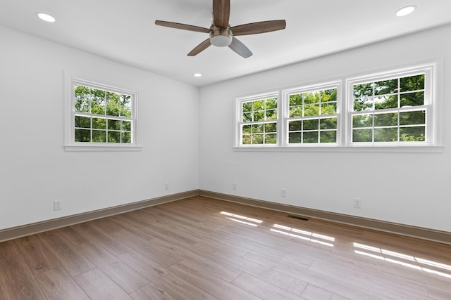 unfurnished room featuring ceiling fan and light hardwood / wood-style flooring