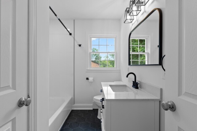 full bathroom featuring tile patterned floors, vanity, toilet, and bathing tub / shower combination