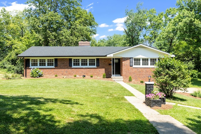 single story home featuring a front yard