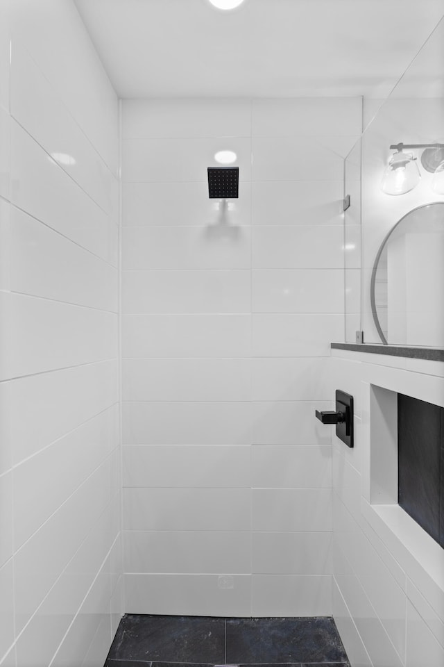 bathroom with a tile shower