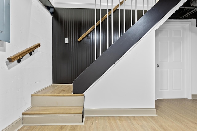 stairs with hardwood / wood-style floors