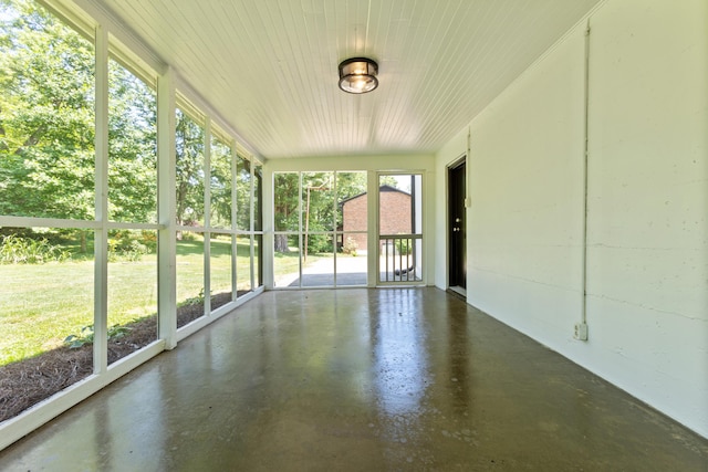 unfurnished sunroom with a wealth of natural light