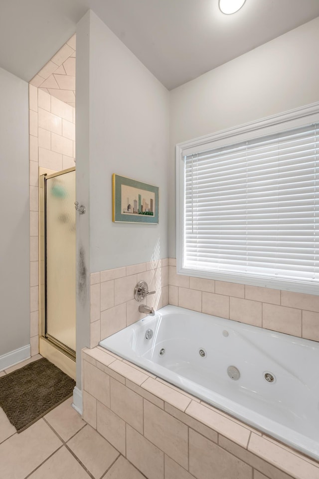 bathroom with separate shower and tub and tile patterned flooring