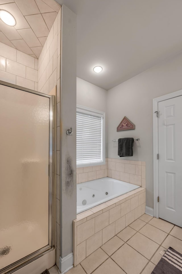 bathroom featuring tile patterned floors and separate shower and tub