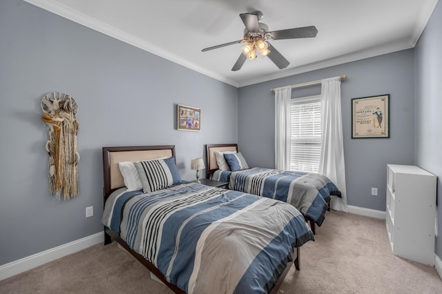 carpeted bedroom with ceiling fan and ornamental molding