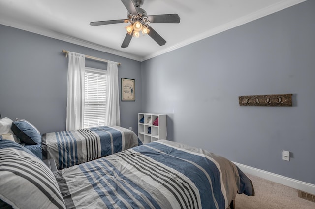 carpeted bedroom with ceiling fan and ornamental molding