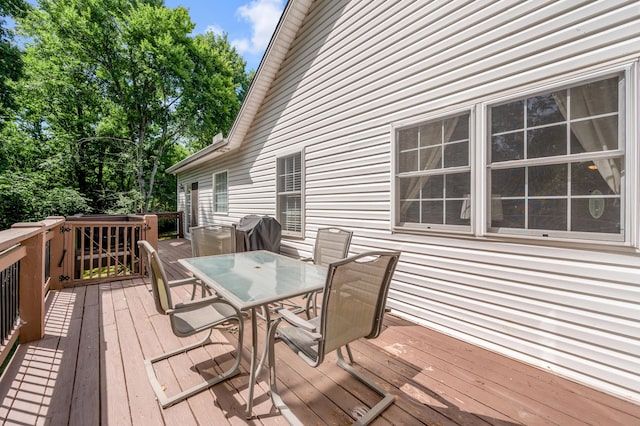 wooden deck with grilling area